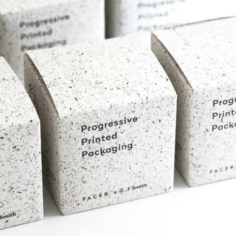 A line up of folded cartons produced in alternative sustainable material Notpla with embossed lids and printed sides.